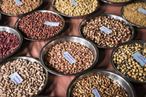 pots of colourful grains with tags on each of them
